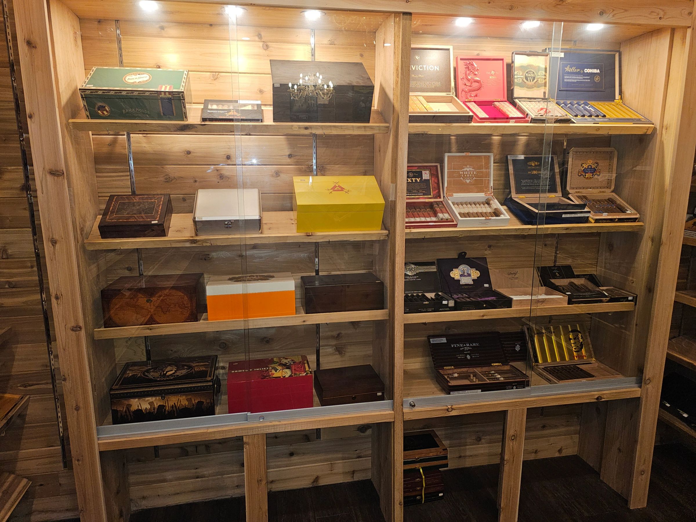 Cigar boxes on the humidor shelves