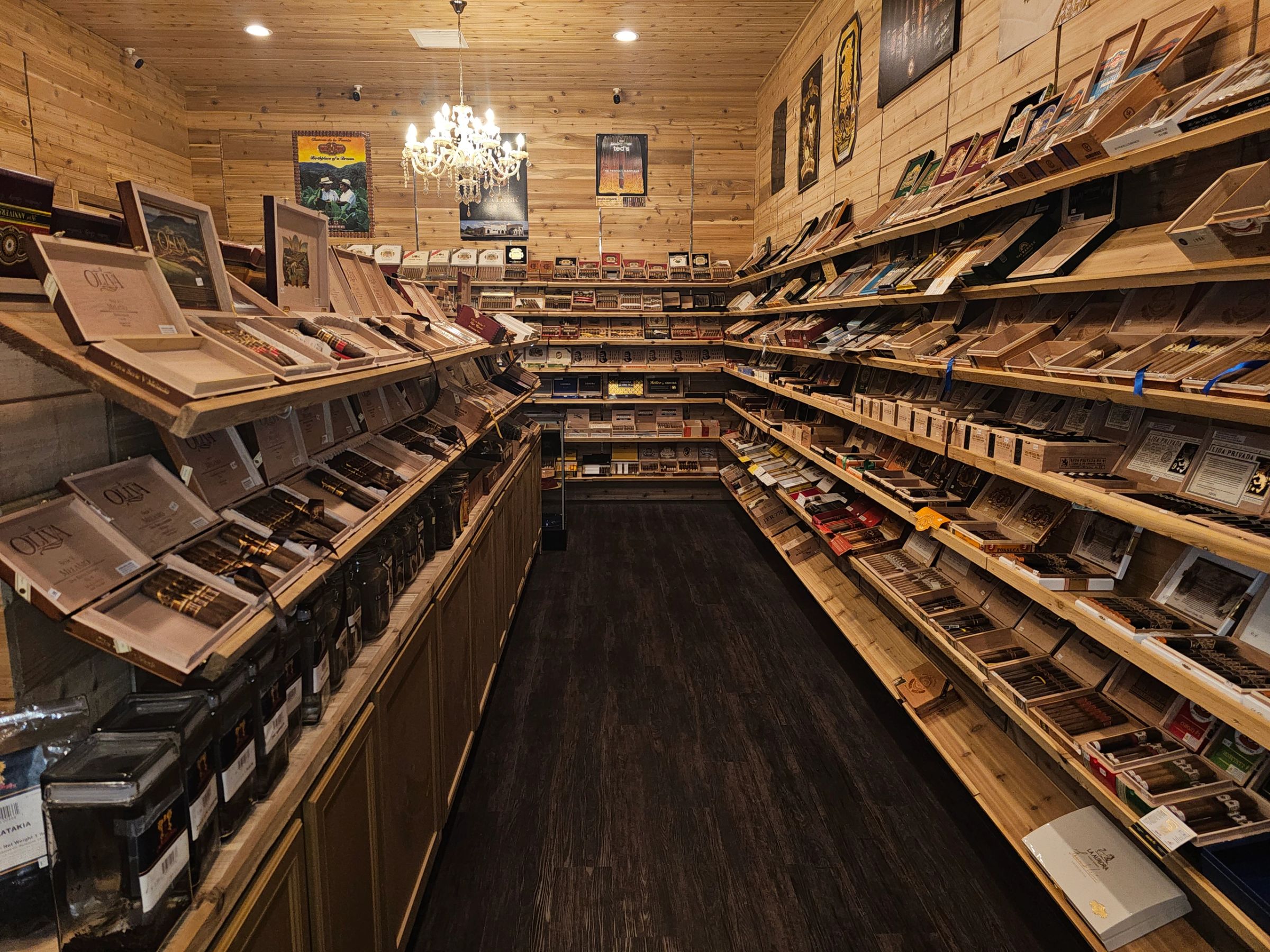 Humidor shelving stocked with cigar boxes